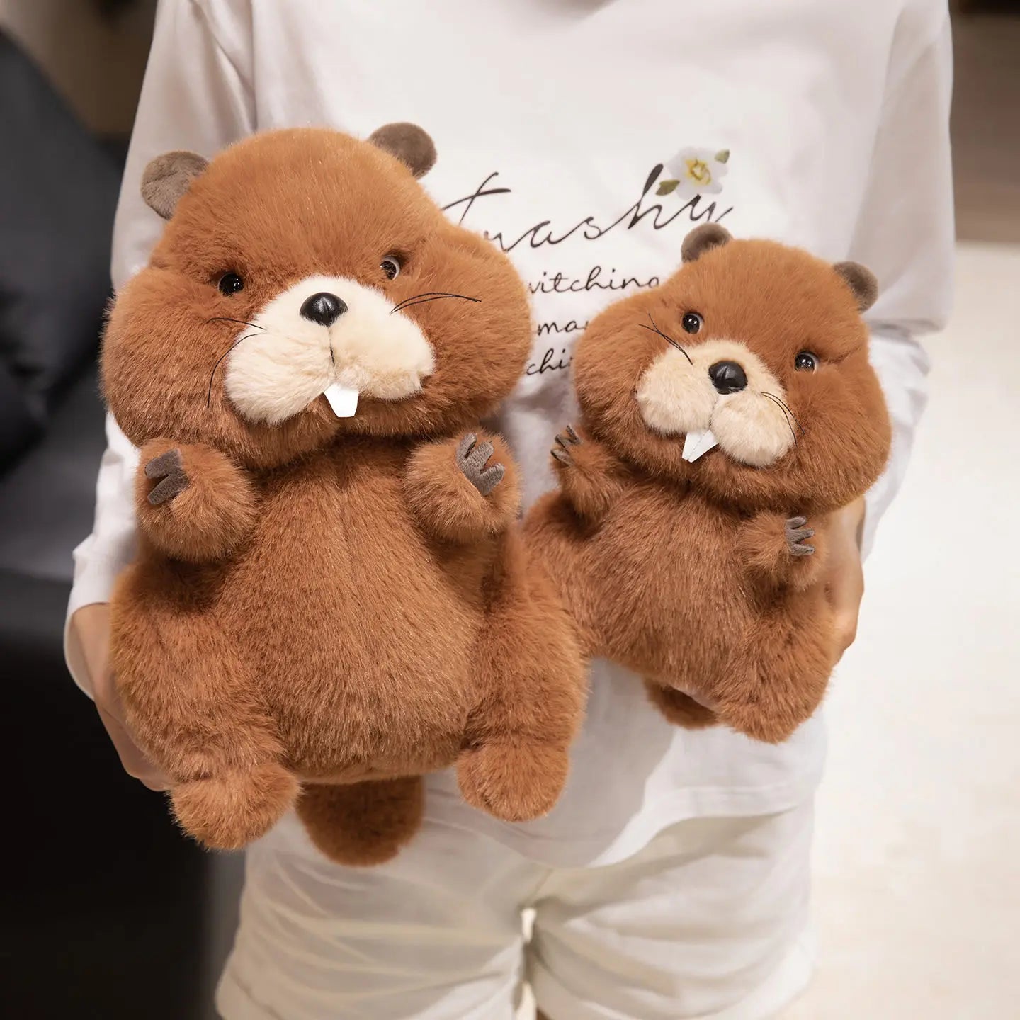 Chubby groundhog plushie displayed on a wooden desk as a cute companion