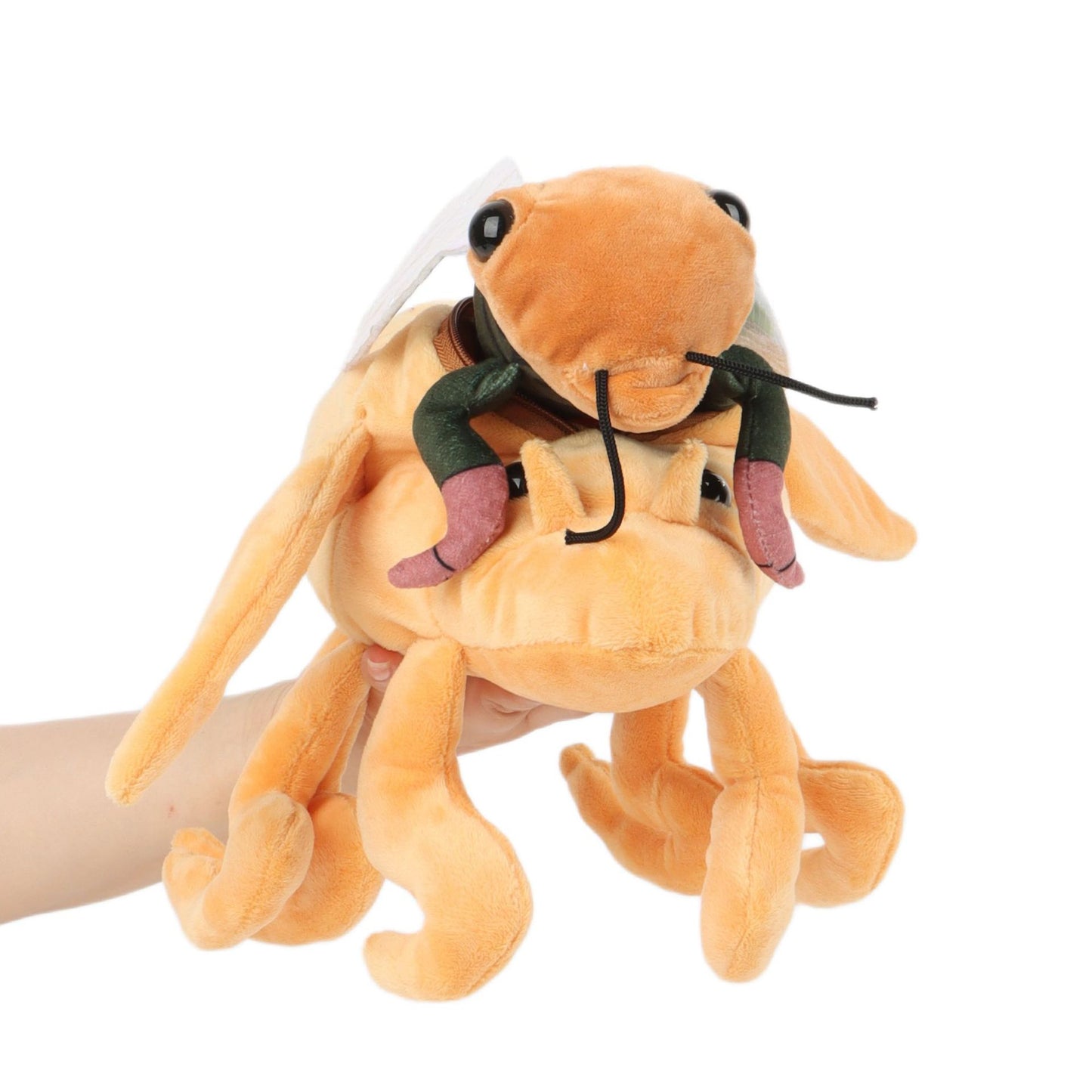 Cicada plushie unzipped showing winged adult insect emerging from nymph shell