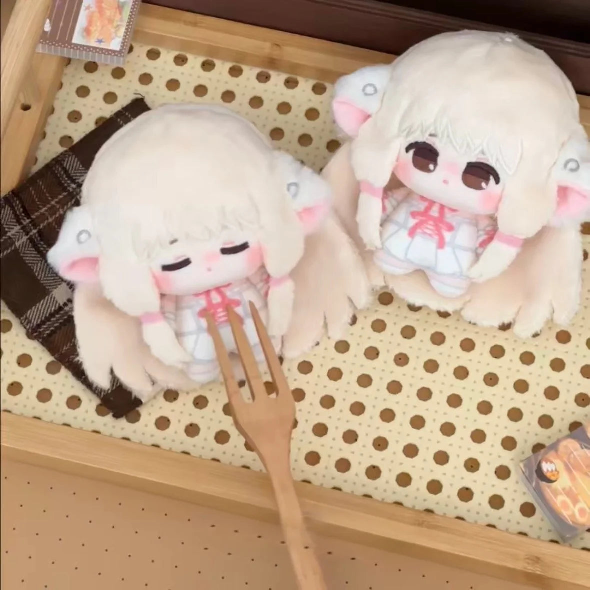 Close-up of Chii plushie face showing soft cotton texture and gentle details
