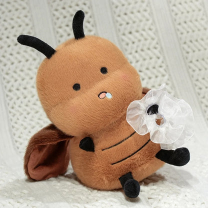 Close-up of Cool Gangster roach stuffed animal face and sunglasses accessory detail