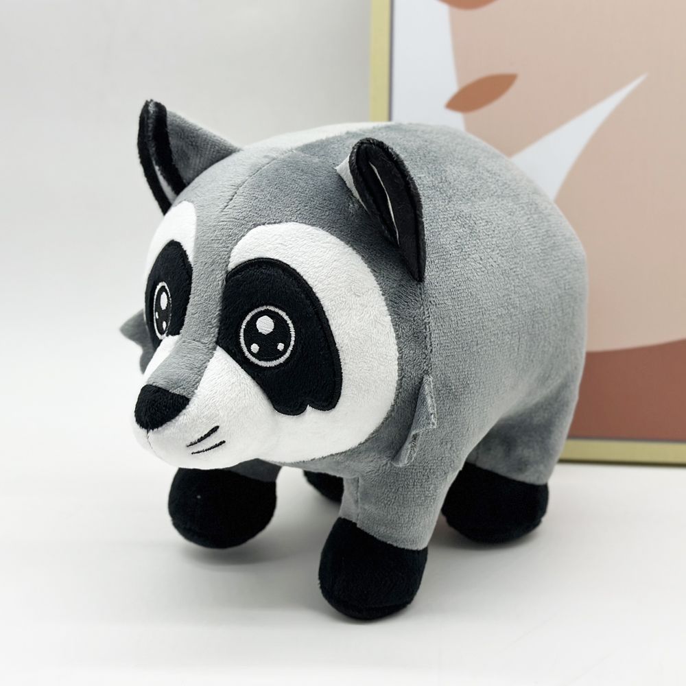Close-up of Jimothy raccoon plushie face with mask markings and grey fur