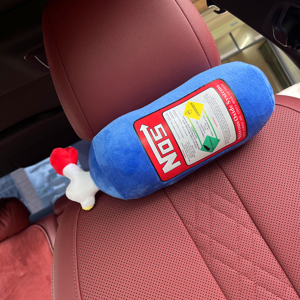 Close-up of NOS bottle plush fabric texture and stitching detail
