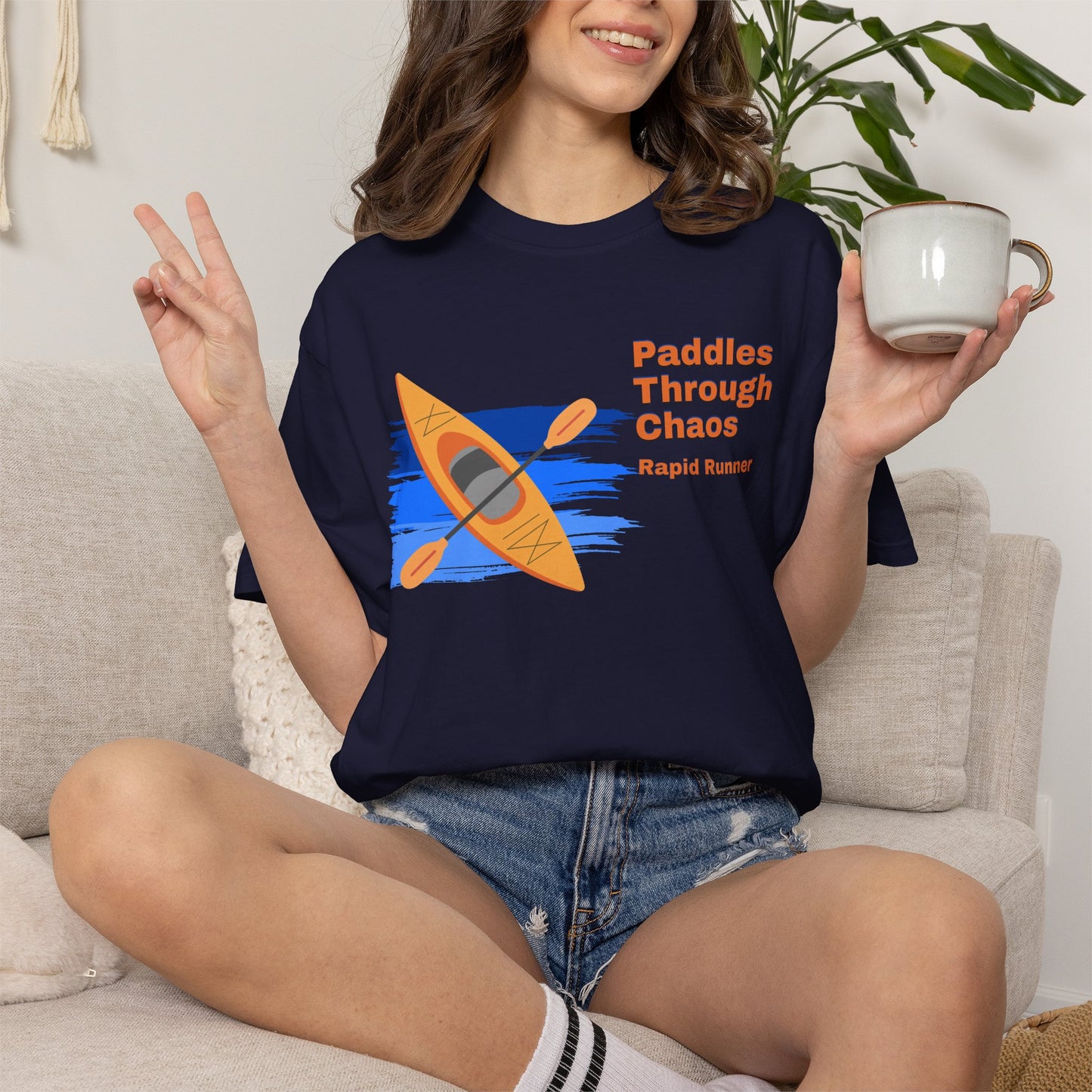 Close-up of Paddles Through Chaos graphic on water sports tee