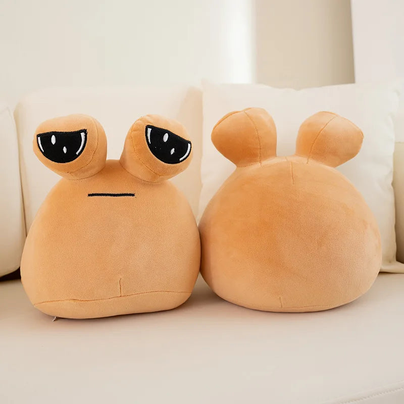 Close-up of Sad Pou stuffed animal face showing large circular eyes and soft plush texture