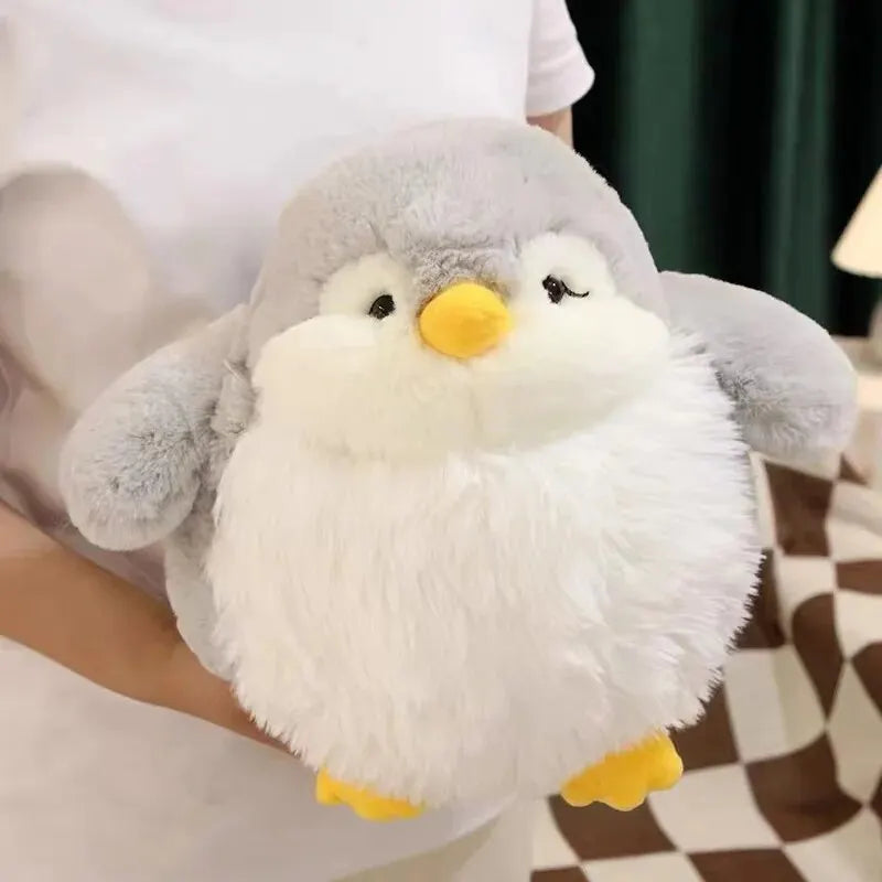 Close-up of a realistic penguin plush showing its signature black-and-white countershaded plumage.