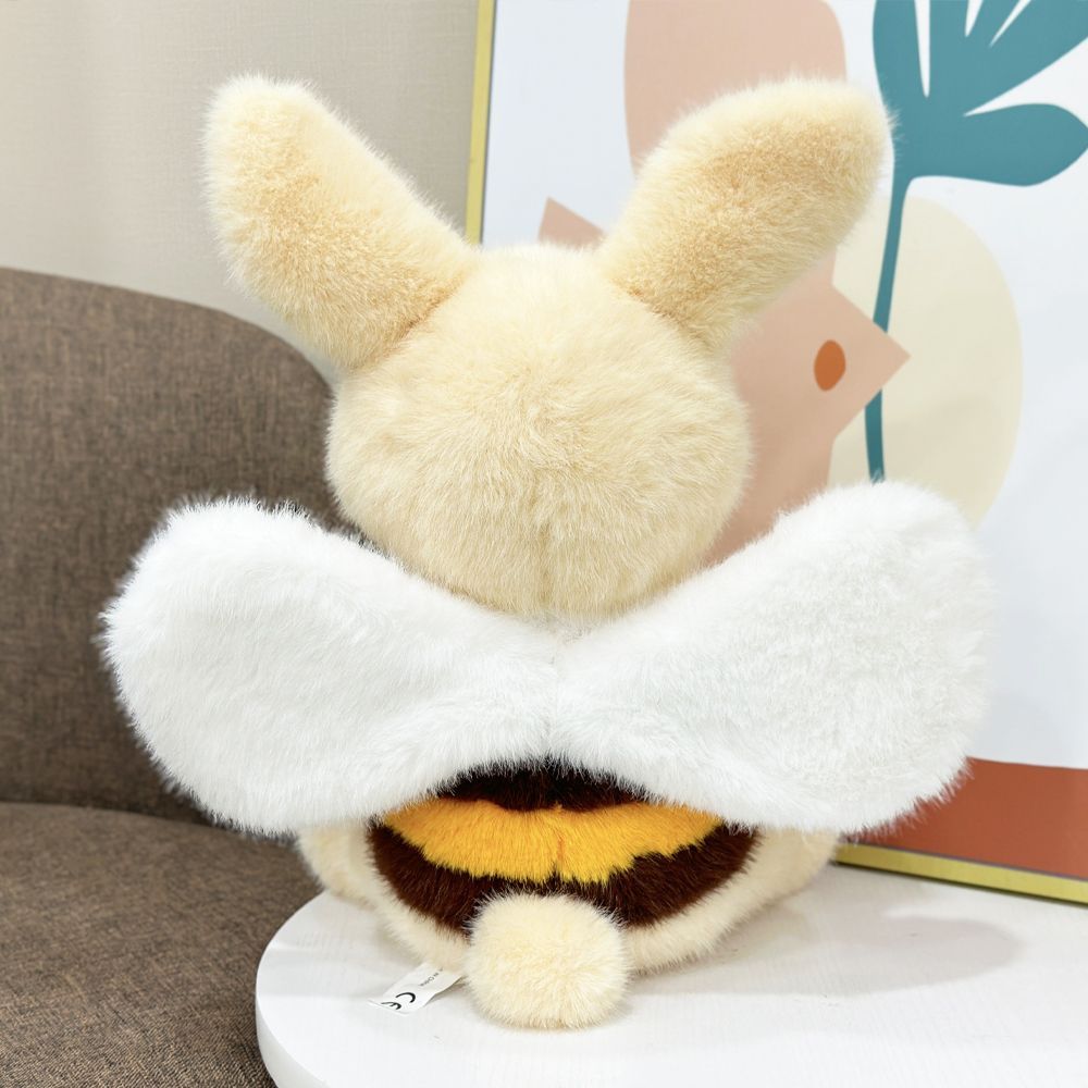 Close-up of embroidered face on bumblebee bunny plush