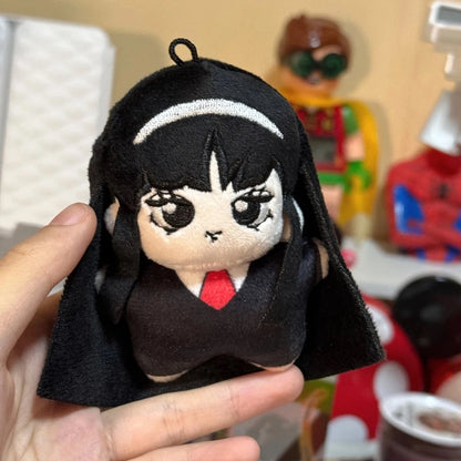 Close-up of handmade horror plush collectible showing detailed facial features and signature beauty mark