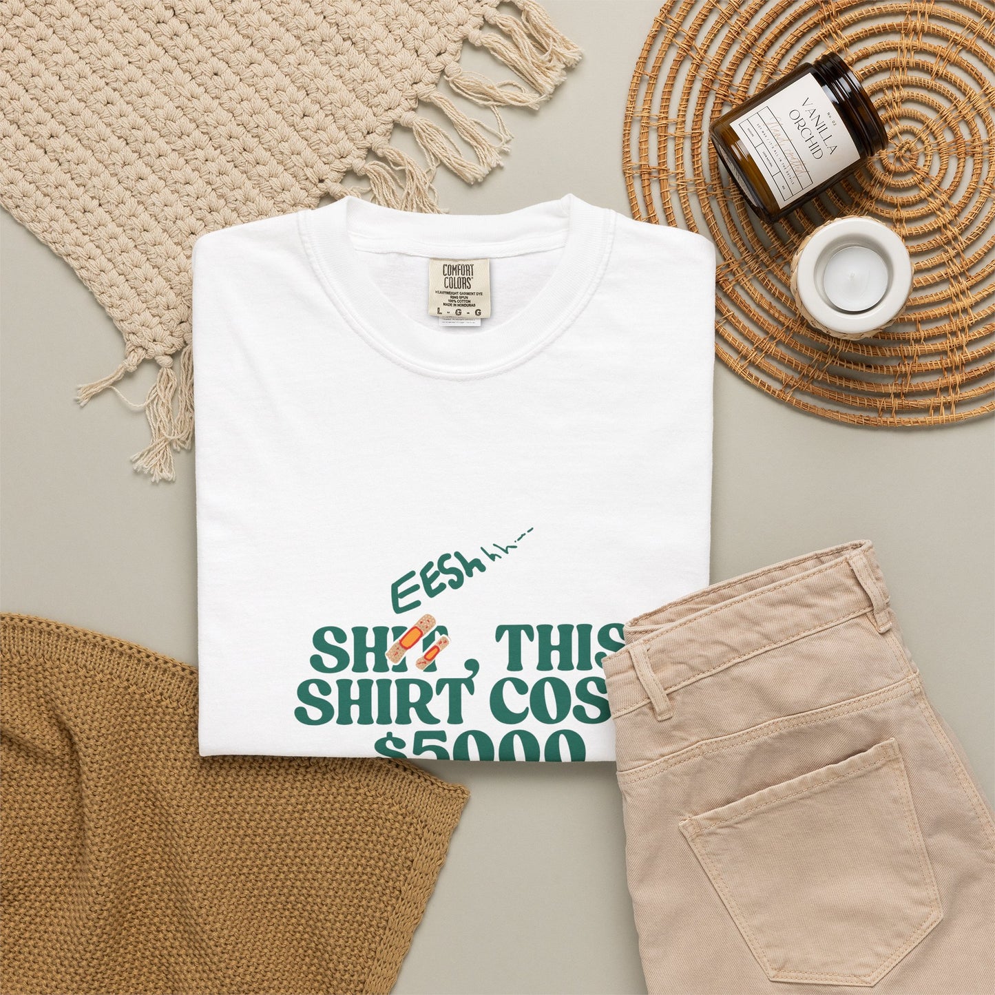 Close-up of humorous typographic graphic on white garment-dyed cotton tee