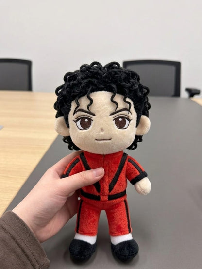 Close-up of pop star fan plush face and costume detail
