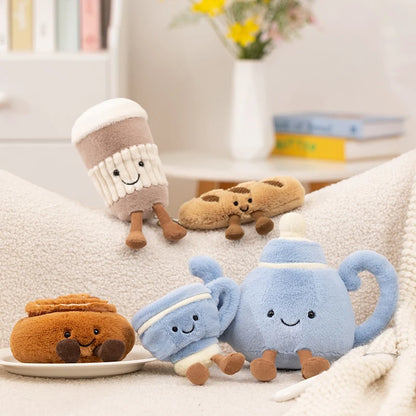Close-up of tea pot plushie with embroidered smile and corduroy legs, handmade food plushie