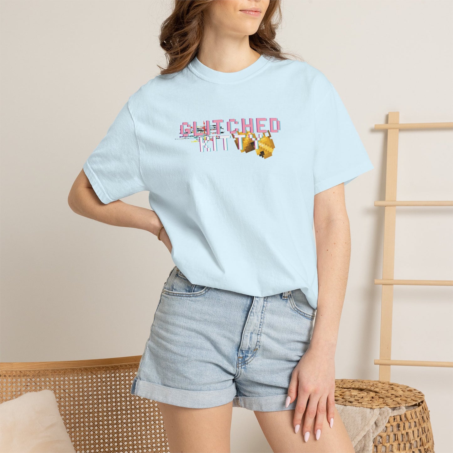 Close-up of the heavyweight, garment-dyed cotton fabric texture showing the high-quality print of the pixelated cat.