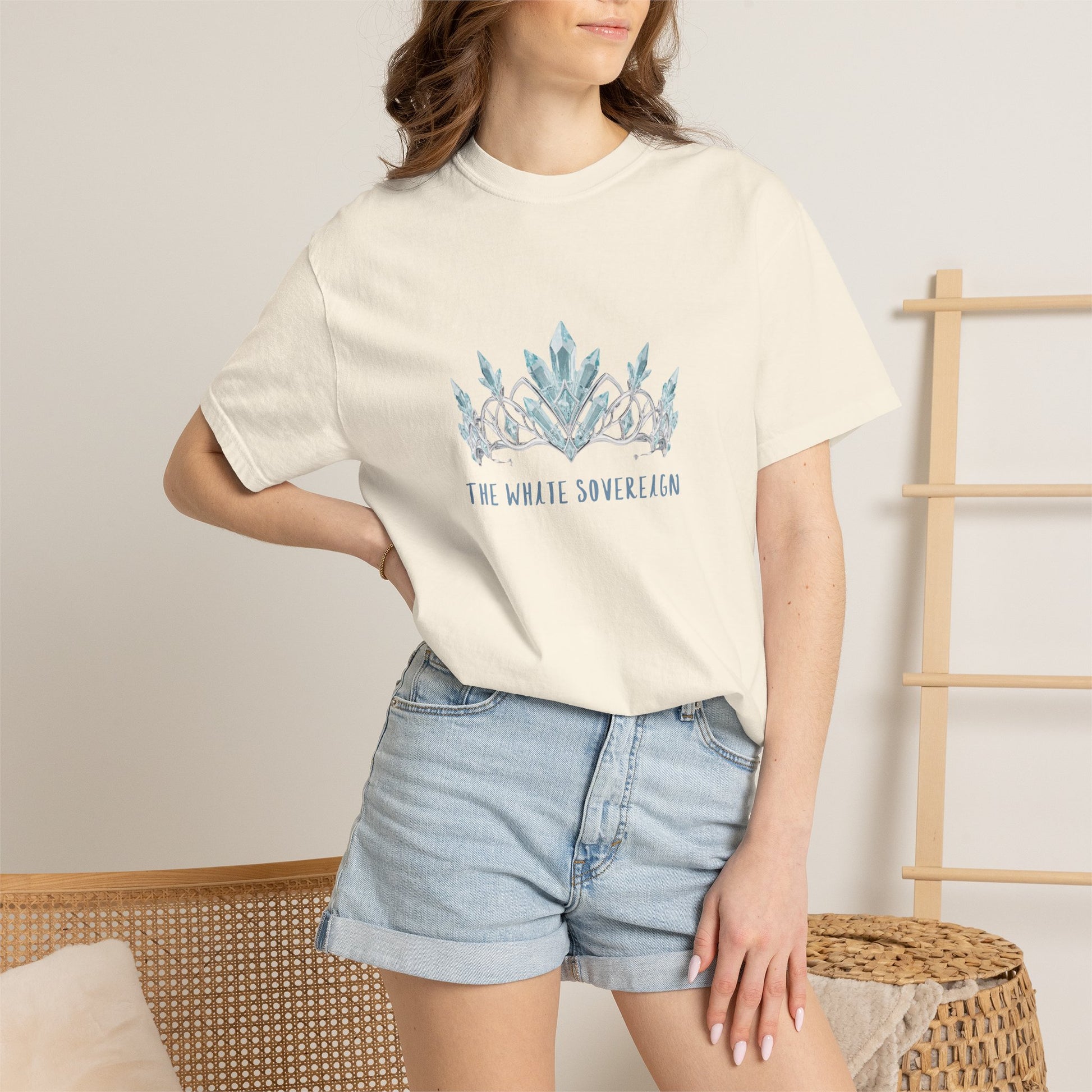 Close up detail of the watercolor crown crest on The White Sovereign frost empress graphic tee showing layered blue print tones
