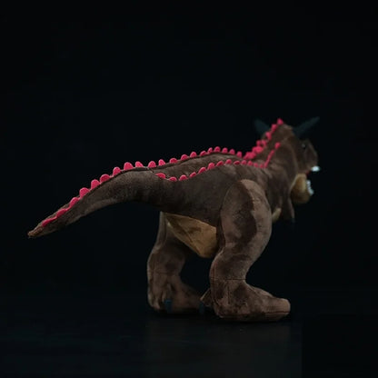 Close up of Carnotaurus plush head showing horn texture and premium plush fabric quality