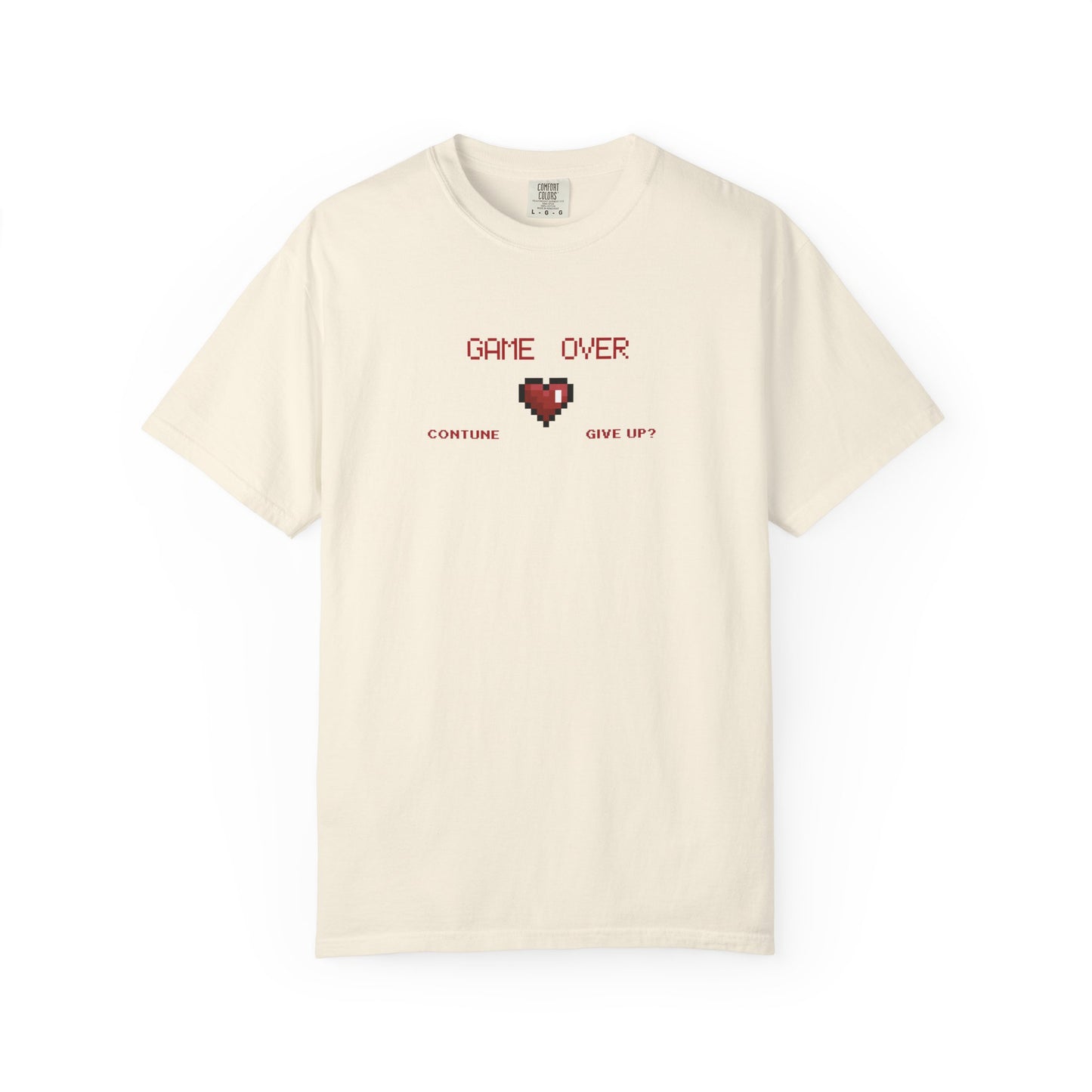 Close up of cracked pixel heart graphic with GAME OVER text on muted garment dyed vintage gaming tee

