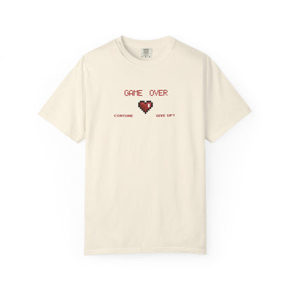 Close up of cracked pixel heart graphic with GAME OVER text on muted garment dyed vintage gaming tee

