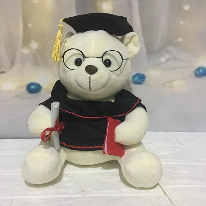 Close up of graduation teddy bear face with black graduation cap and yellow tassel
