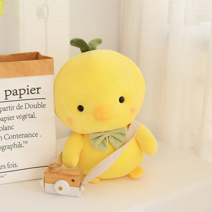 Close up of green sprout head detail on kawaii yellow chick plushie