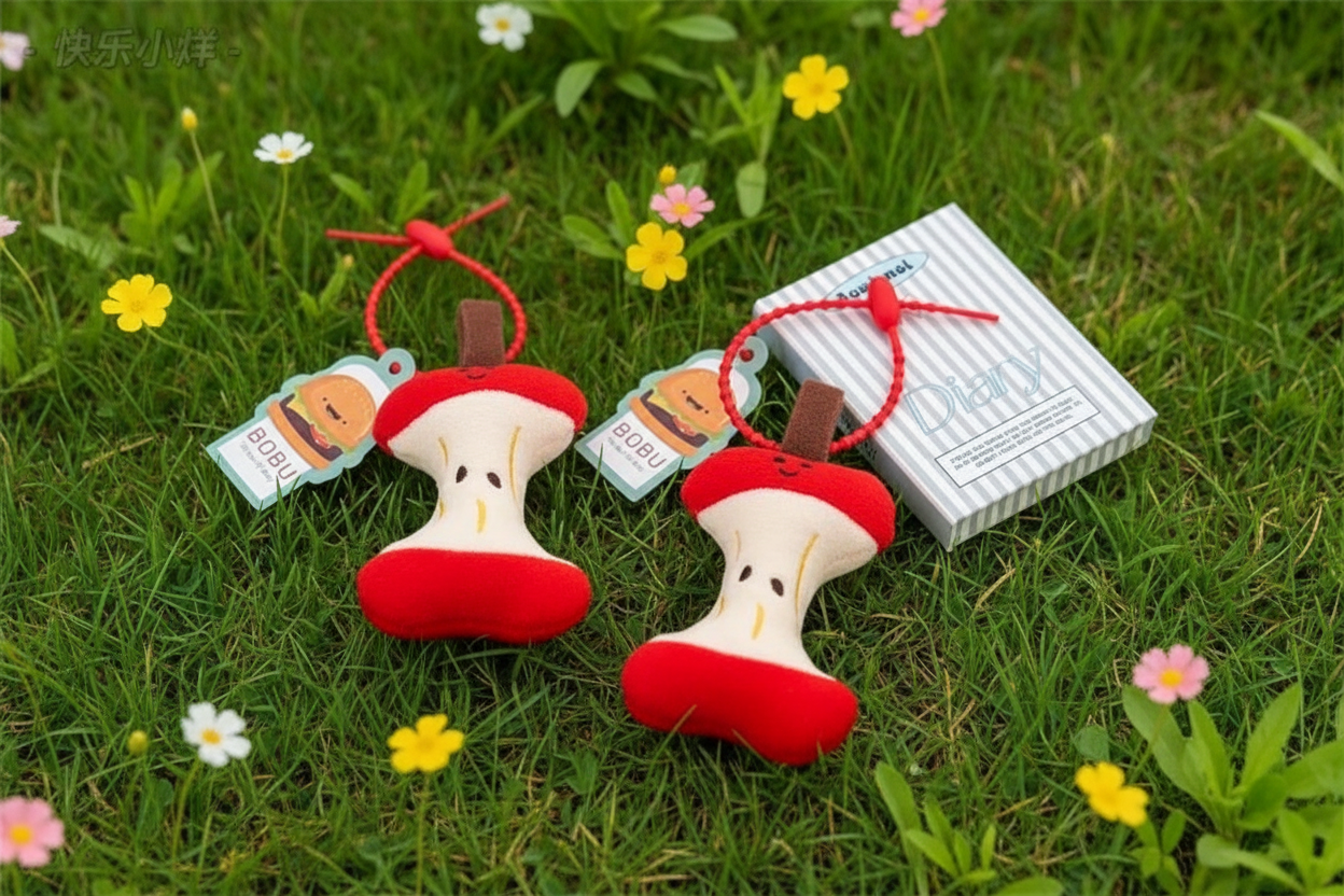 Close up of kawaii apple accessory with tiny embroidered seeds