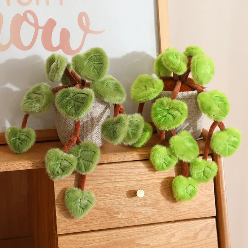 Close up of pothos plant plush heart shaped leaf detail polyester fabric