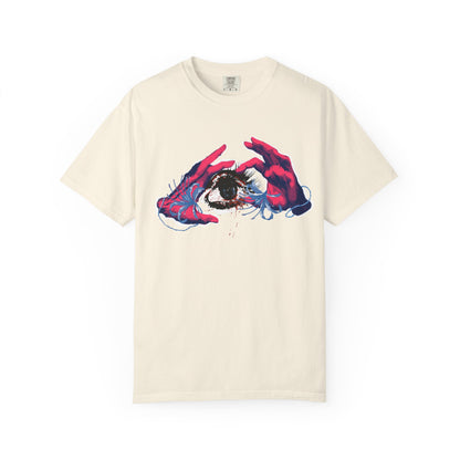 Close up of psychedelic graphic tee print featuring painterly hands cradling a single intense eye