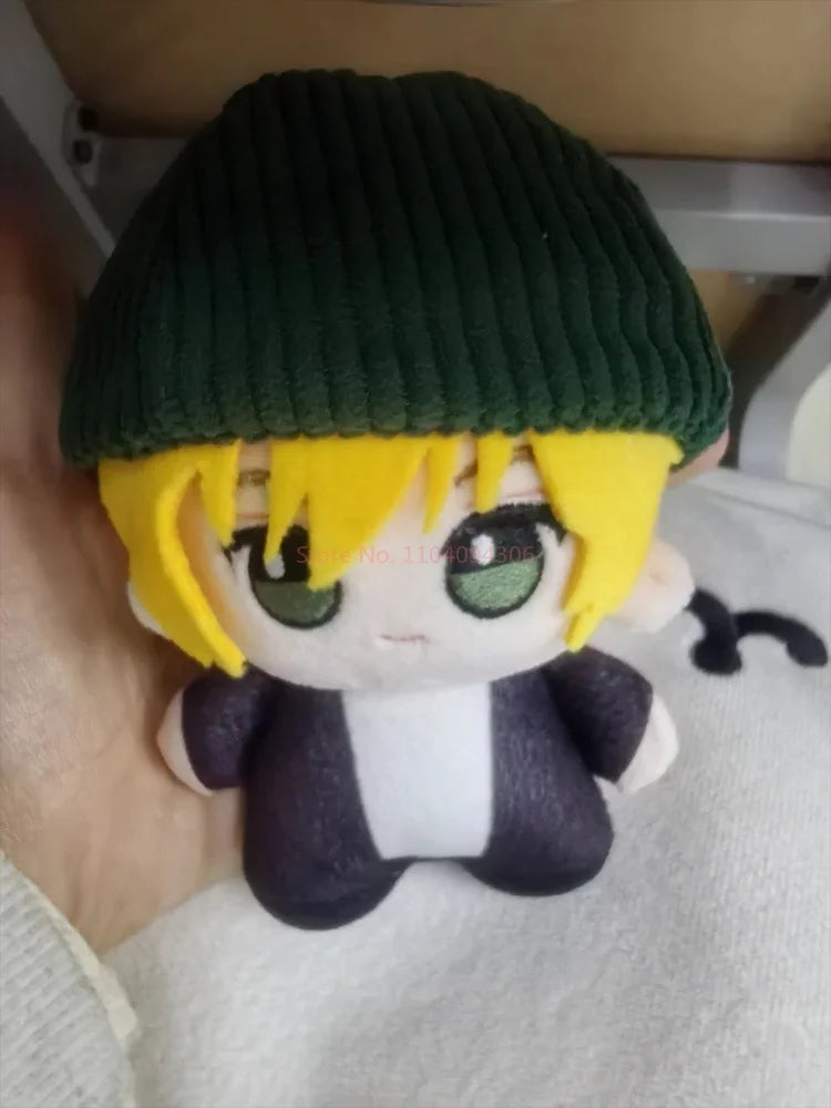 Closeup of Sam plush face spiky blonde hair soft toy detail
