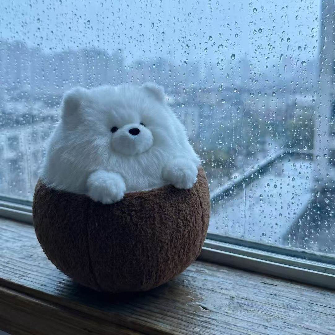 Coconut dog plush front view showing round Pomeranian-style white puppy in coconut
