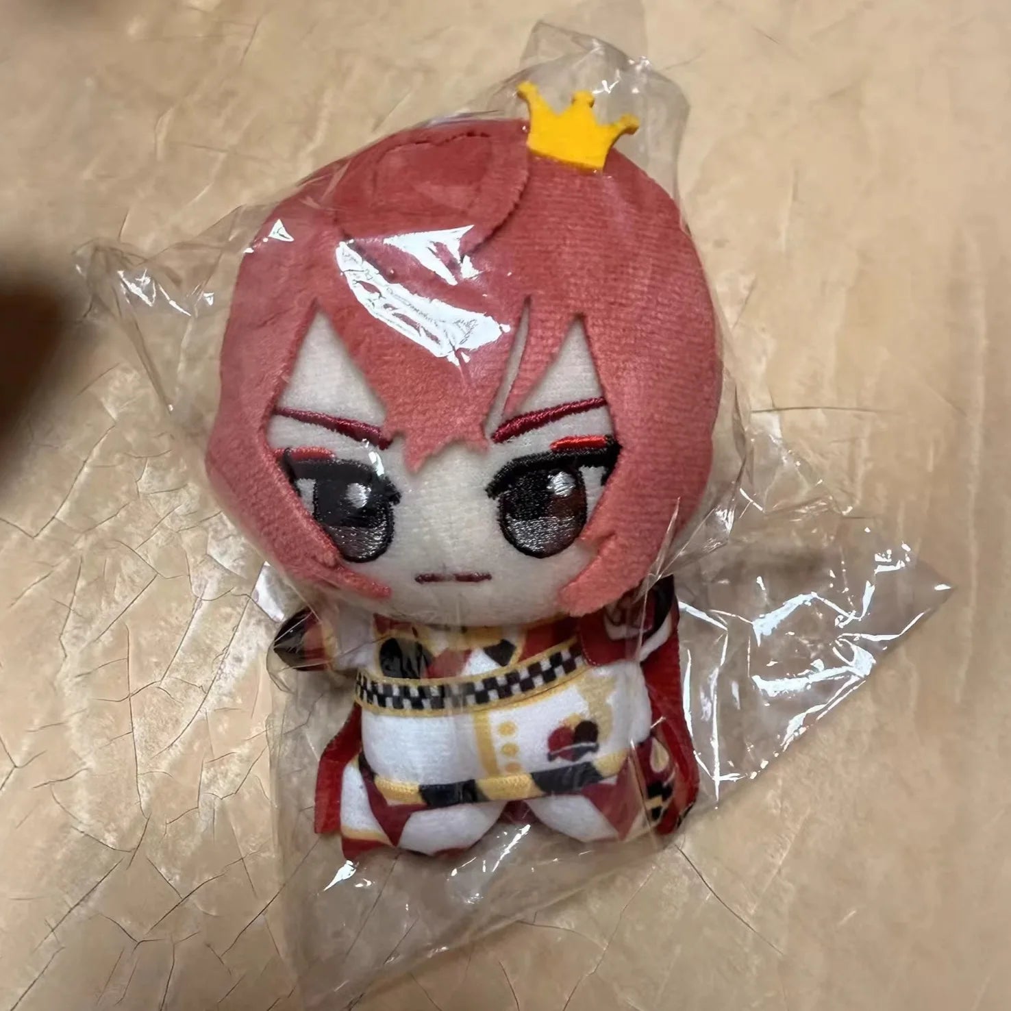 Collectible anime plush figure 10cm size comparison with hand
