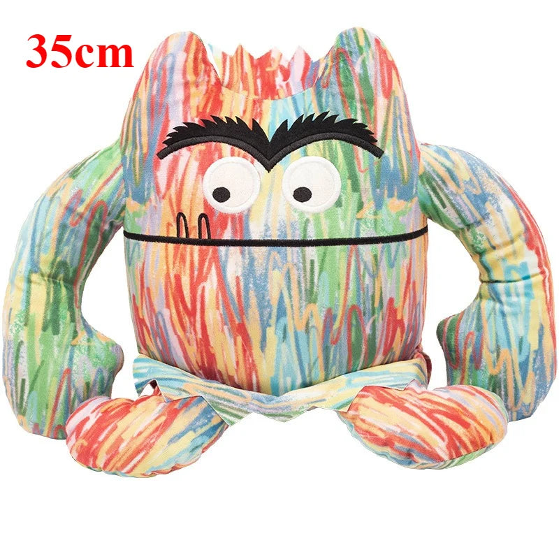 Color coded emotions toy emotion monster next to a smiling child during a feelings activity