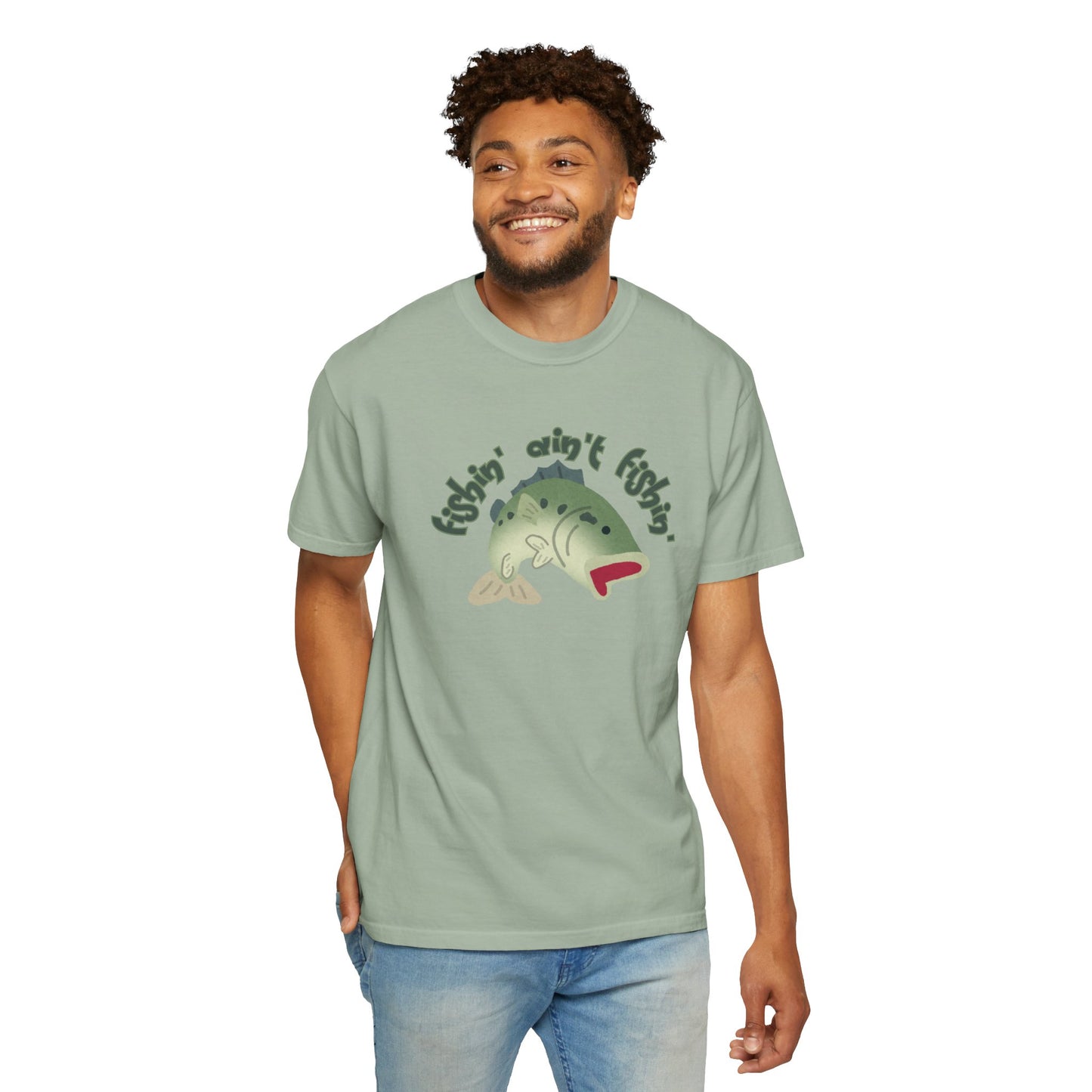 Comfort Colors bass tee folded next to fishing rod and tackle