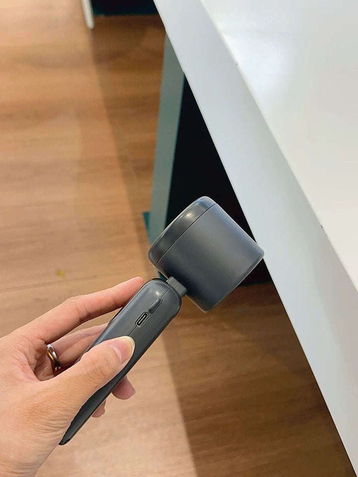 Compact handheld fan folded into pocket size next to iPhone for scale
