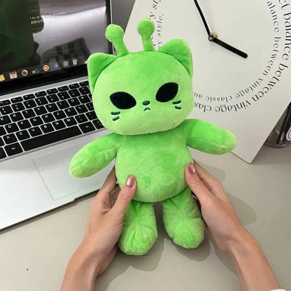 Comparison of the alien cat plush next to a standard pillow