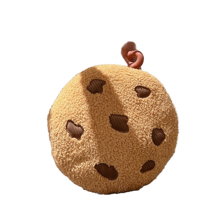Cookie plush seat cushion 45cm sitting on a cozy armchair
