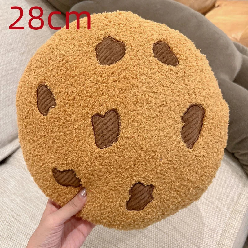 Cookie stuffed toy 10cm pendant size next to a 45cm cookie seat cushion showing size comparison