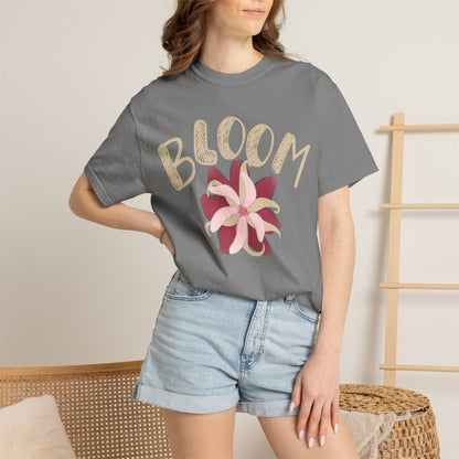 Cottagecore aesthetic clothing flat lay with bloom tee, linen trousers, and straw hat