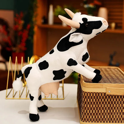Cow plush collectible gift presented in a box with tissue wrap