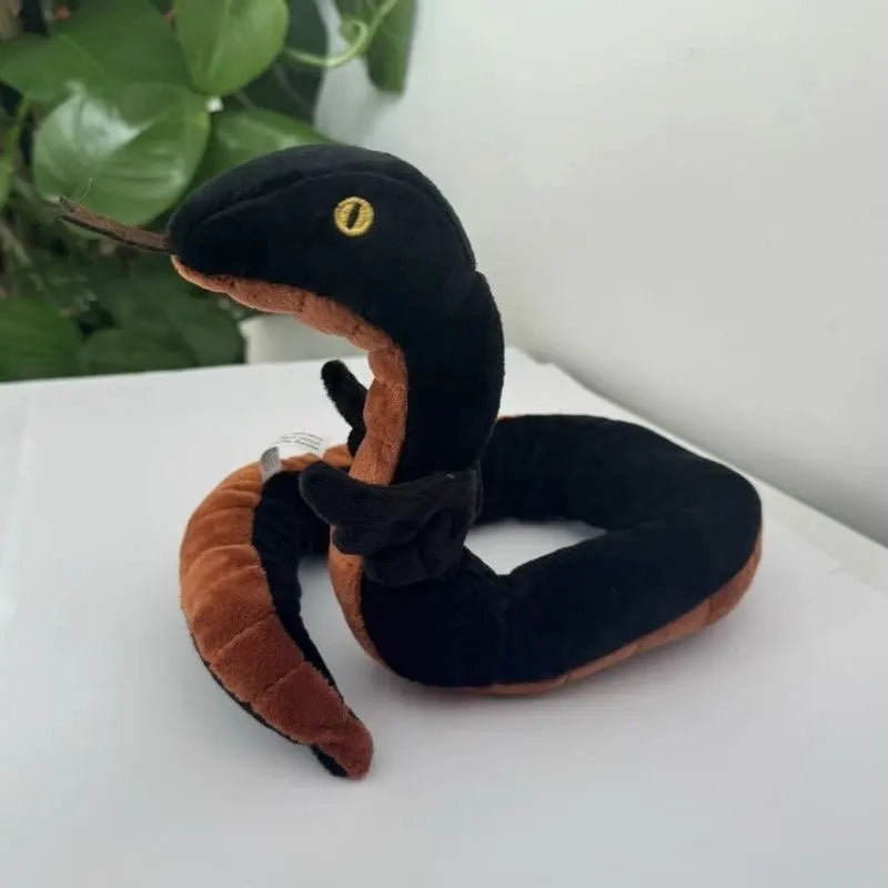 Crowley plush and Aziraphale plush displayed together