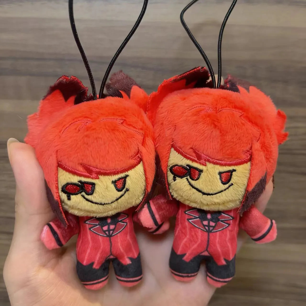 Cute Alastor plush smiling demon character figurine
