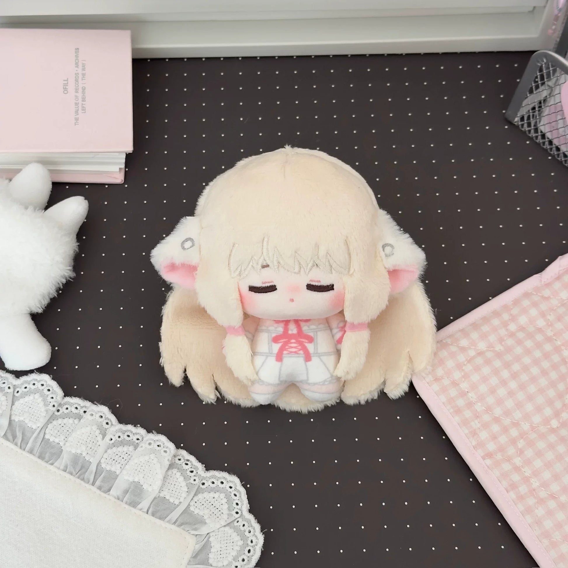Cute anime plushie Chi styled in pastel kawaii display setting