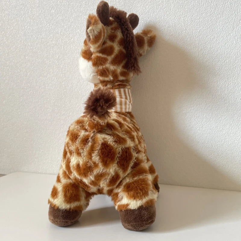 Cute baby giraffe stuffed animal with scarf as a newborn gift wrapping idea