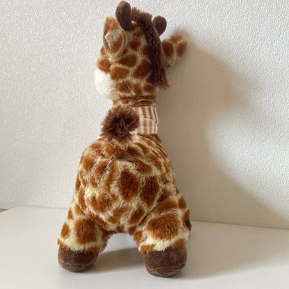 Cute baby giraffe stuffed animal with scarf as a newborn gift wrapping idea