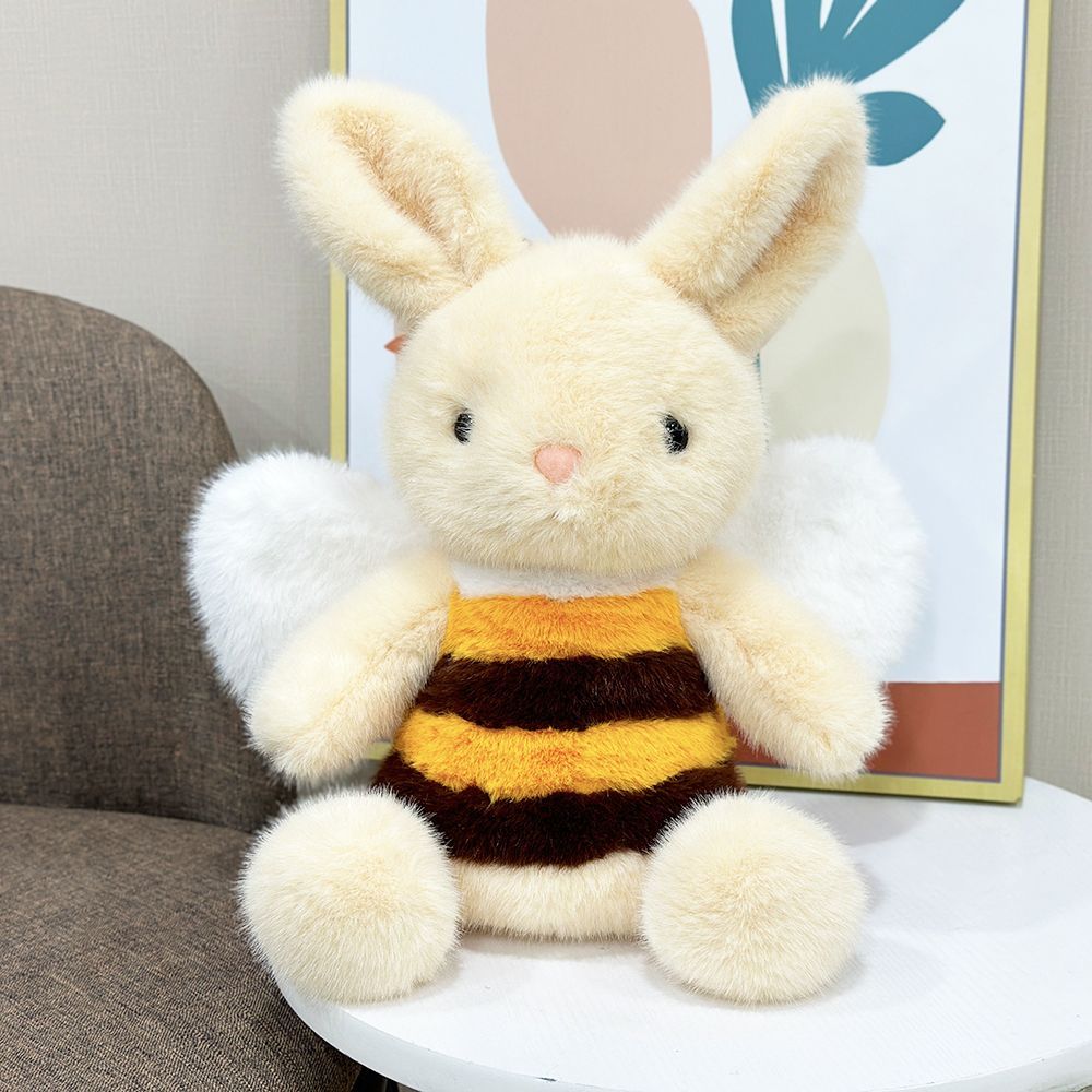 Cute bee plushie with striped yellow and black body and organza wings