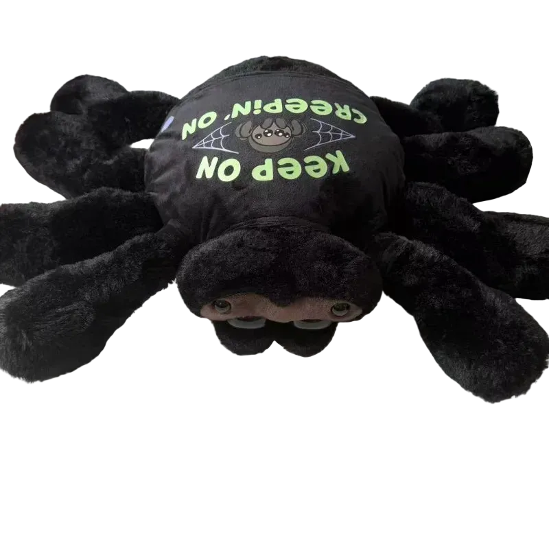 Cute black jumping spider plush with removable clothes sitting upright on white background