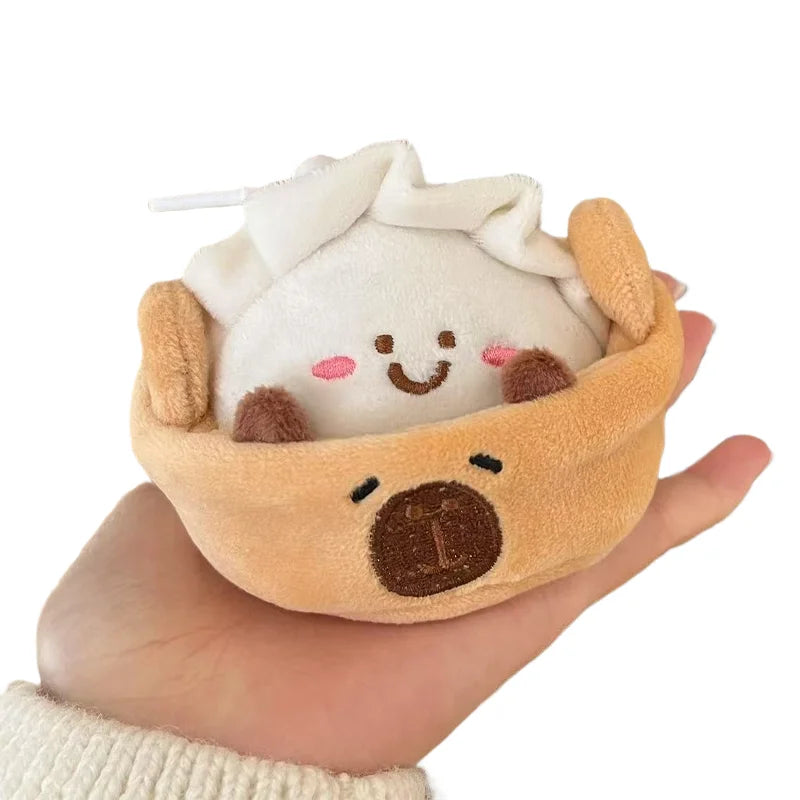 Cute capybara keychain with hide and seek plushie peeking out of steamer basket pouch