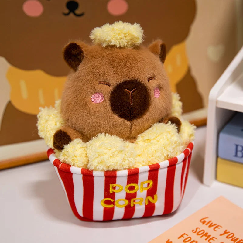 Cute capybara toy desk companion plush sitting on keyboard