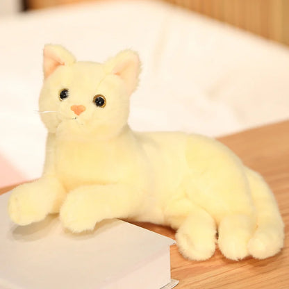 Cute cat plushie in yellow variant with round face and expressive eyes