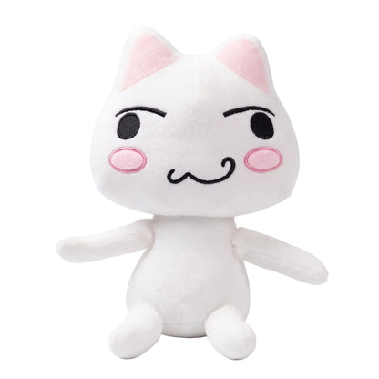 Cute cat plushies displayed on gaming room shelf