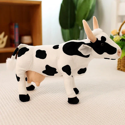 Cute cow soft toy top down view on white background showing classic cow pattern