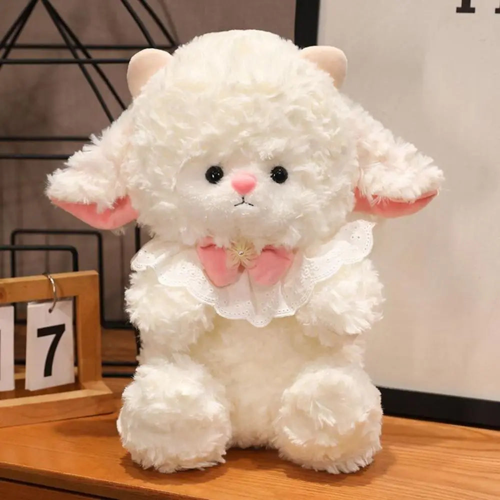 Cute sheep plush gift wrapped with ribbon on pink background