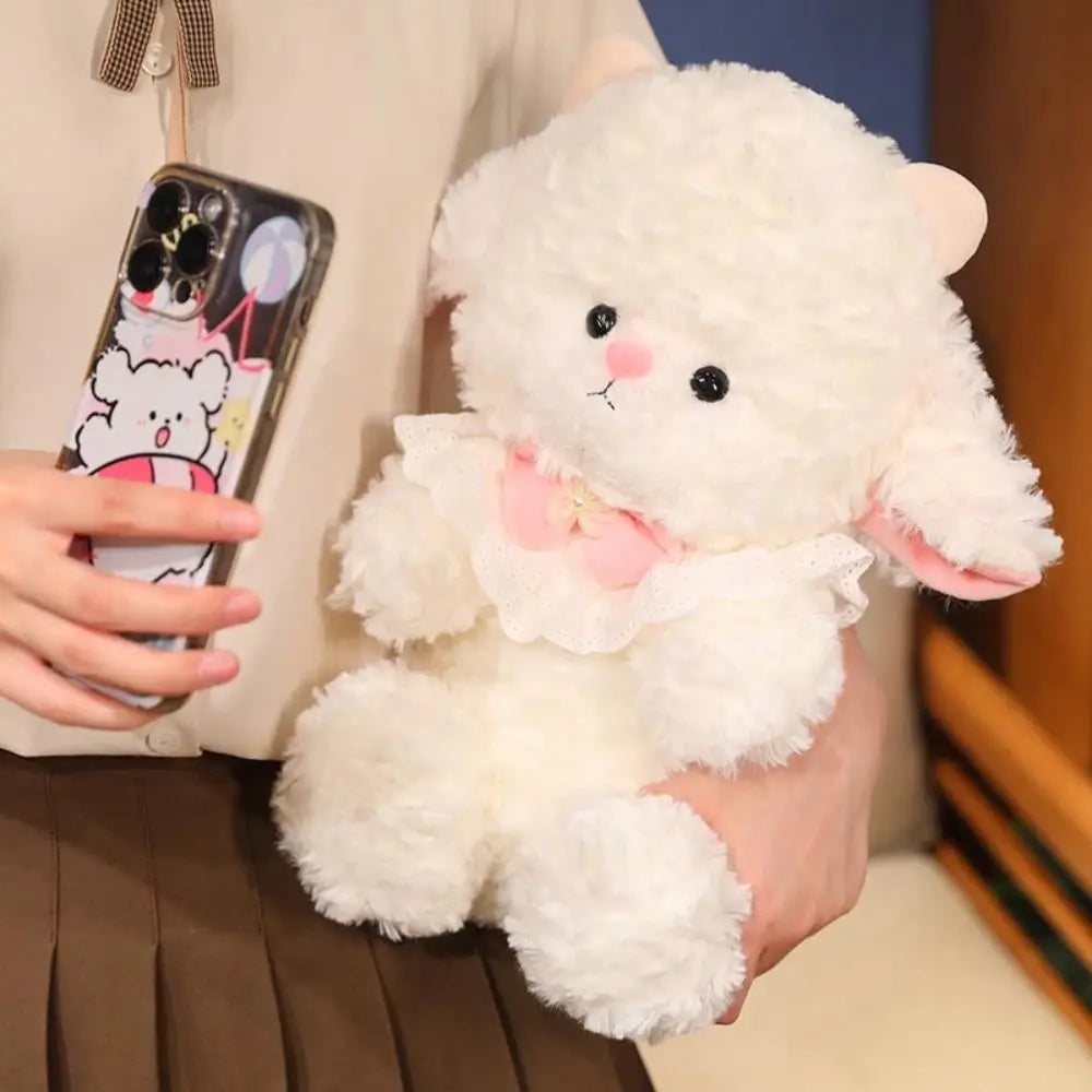 Cute sheep toy sitting upright on pastel bedding