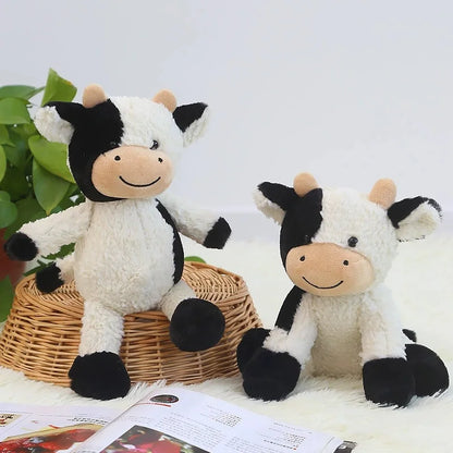 Cute spotted cow stuffed animal showing embroidered nose and eyes closeup